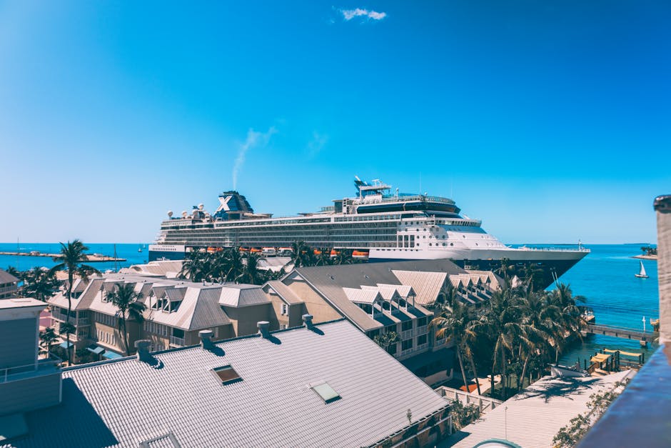 A majestic cruise ship docked in Key West, Florida, under clear blue skies.
